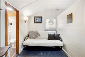 Futon bed with black pillows