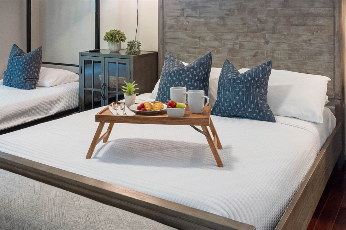This bedroom combines modern style with practicality, offering multiple sleeping options.