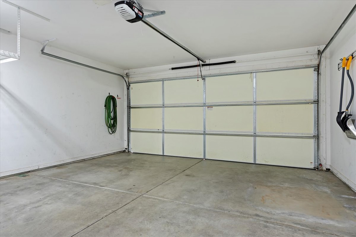 Spacious two-car garage with plenty of room for parking and additional storage.