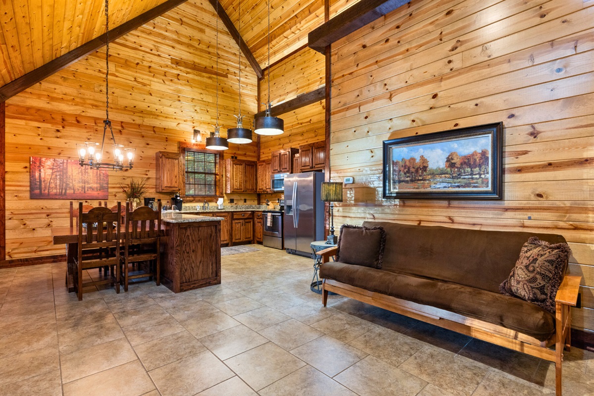 Vaulted ceilings and open design connect kitchen, dining, and living spaces.