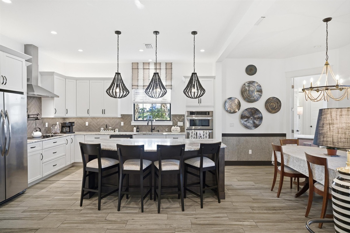 Chef’s kitchen + gathering island 🍽️✨
Cook, snack, and socialize in this bright open-concept space with a huge island, beautiful finishes, and plenty of seating—perfect for family meals and vacation memories.