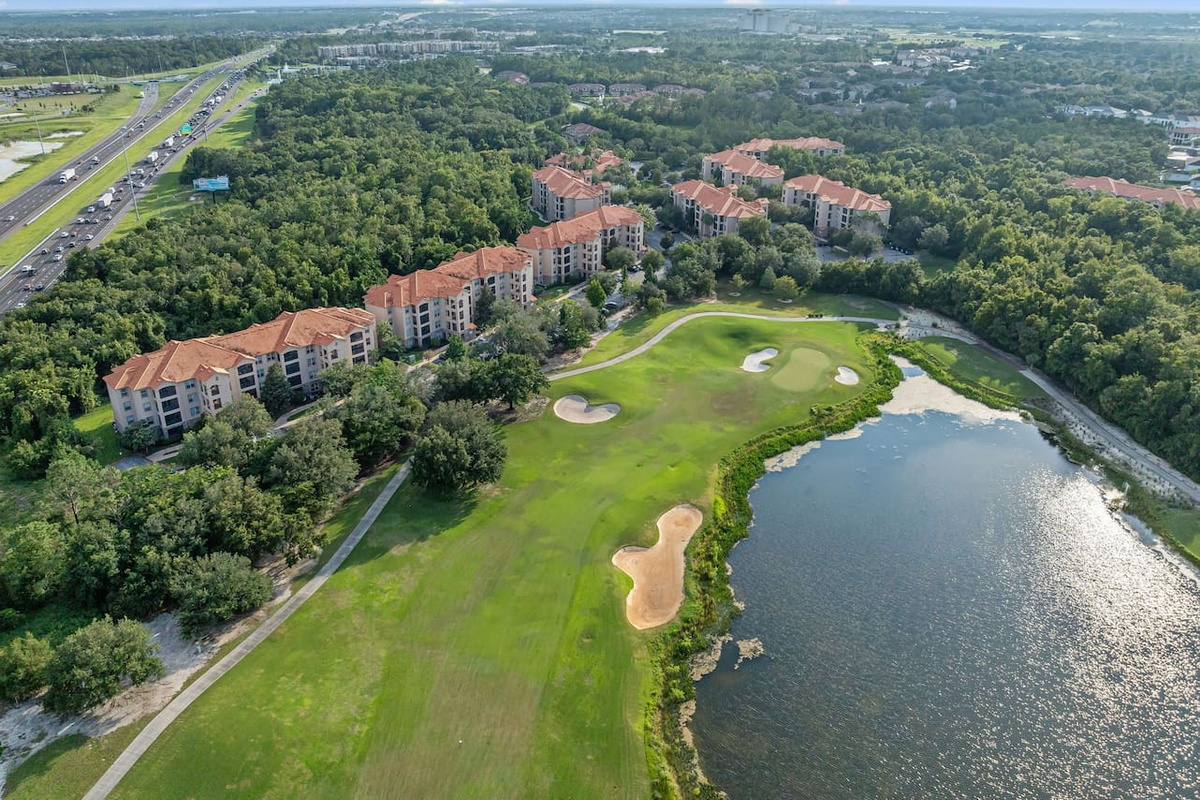 A stunning view of the lush golf course and lake.