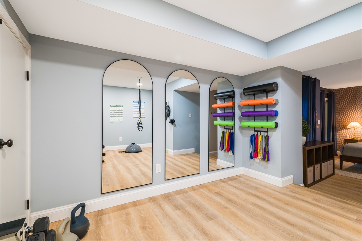 Bright mirrors, colorful mats, and resistance bands make this yoga zone the perfect spot for group stretches, kids’ morning energy burns, or quiet solo sessions. Families love that it offers space for both workouts and play.