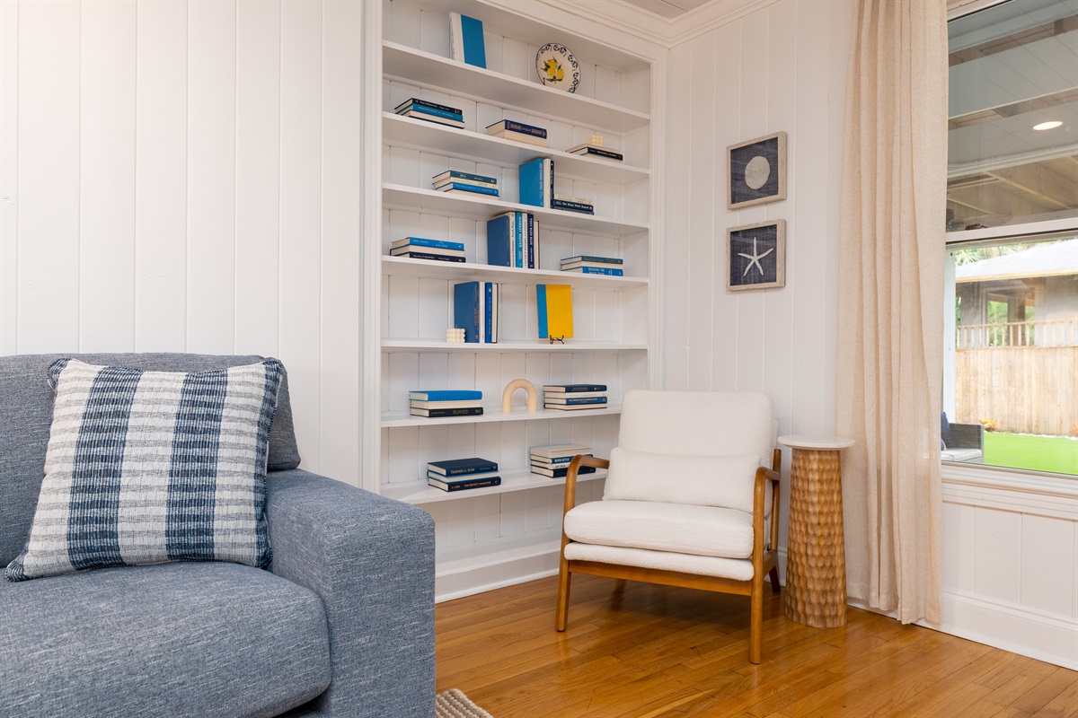 A cozy reading nook with natural light and built-in shelves