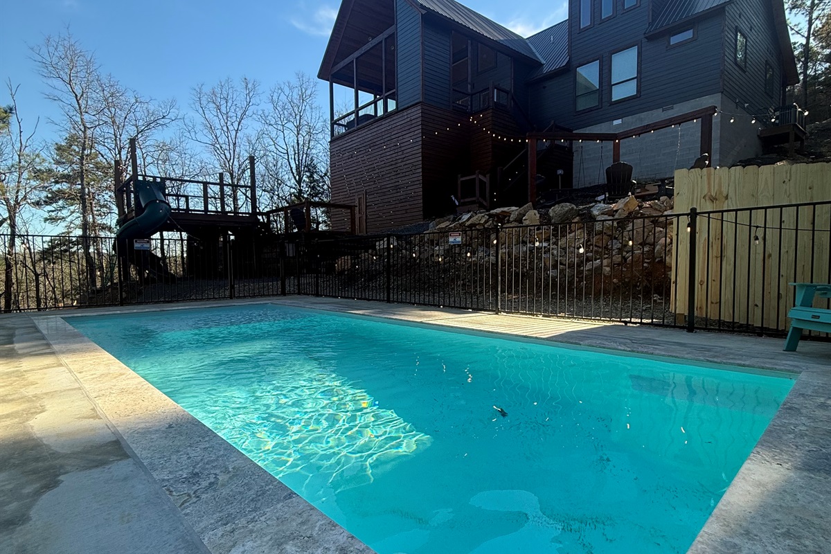 your private oasis awaits — crystal-clear waters below, elevated luxury above, and the forest all around