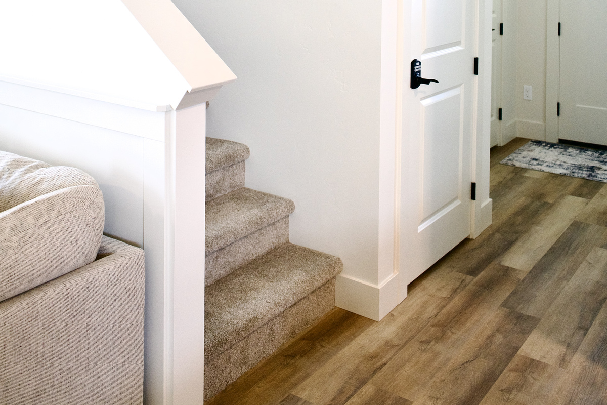 Downstairs, you’ll find a fully stocked kitchen, a spacious open-concept living room, a convenient half bathroom, and a comfortable downstairs bedroom, all thoughtfully arranged to create a welcoming and functional living space.