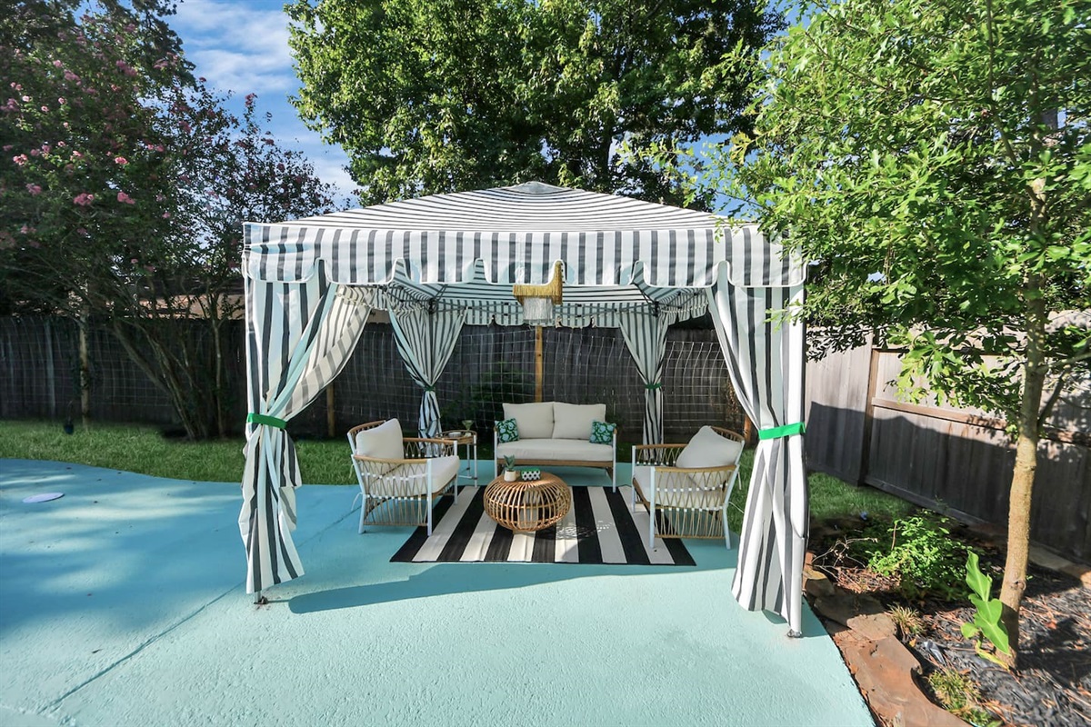 Stylish cabana complete with seating for 4.