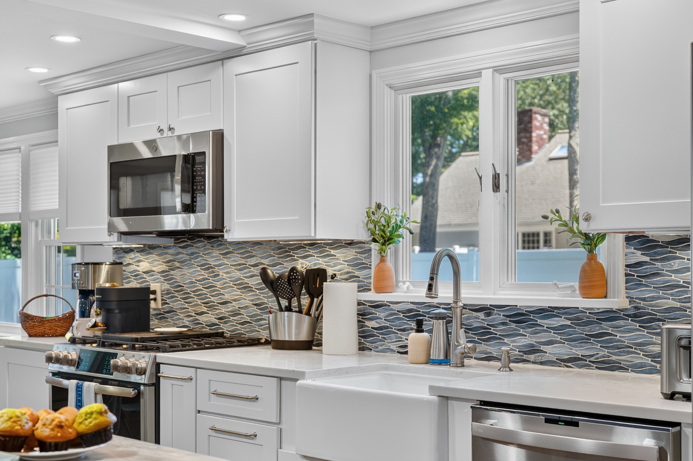 Spacious kitchen with stainless steel appliances and an open, functional layout.