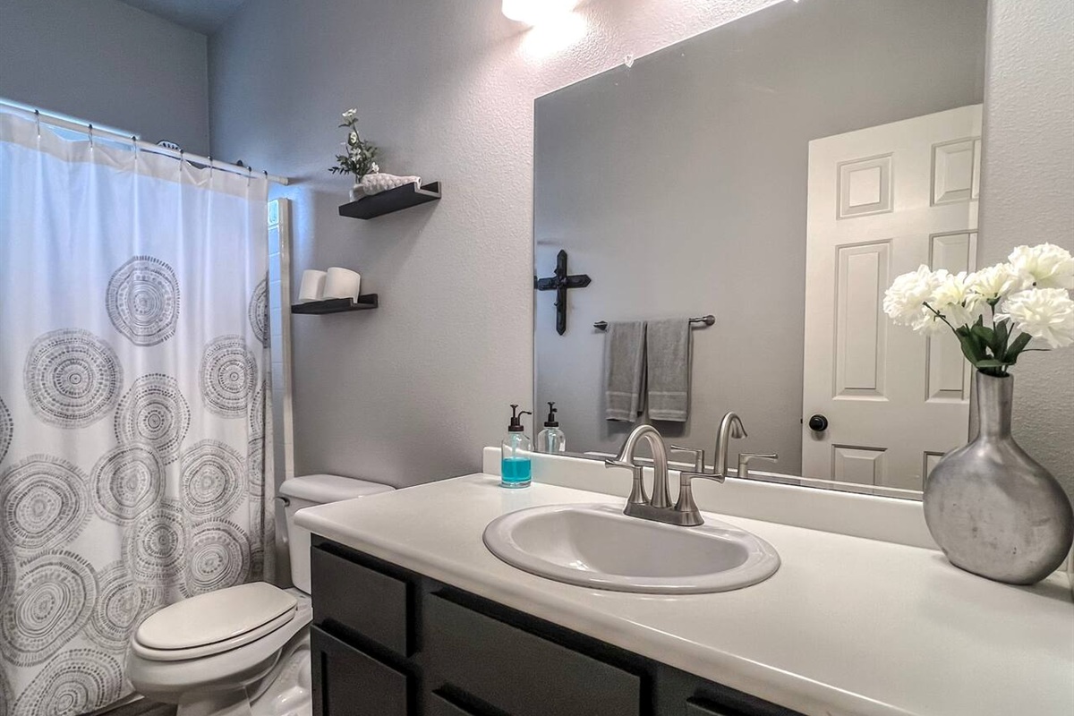 Full bathroom #1 with shower/tub combo and spacious vanity