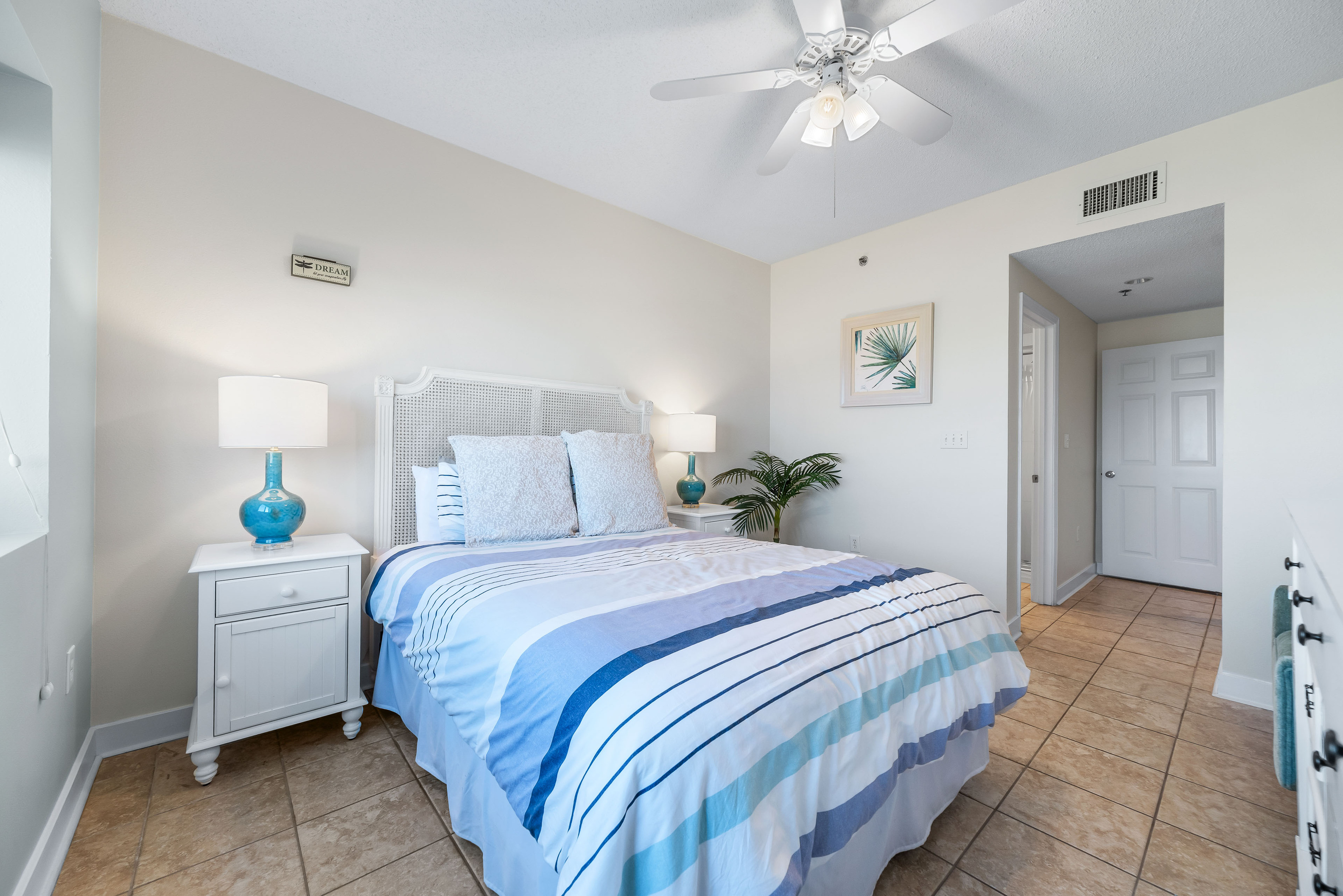 Unwind and recharge in this peaceful bedroom, designed with comfort and a serene ambiance in mind.