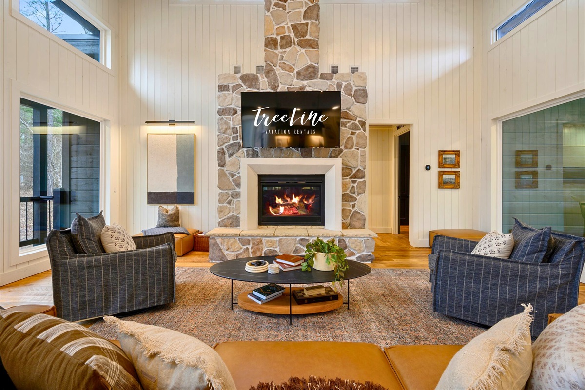 This inviting lounge area blends comfort and style, making it a great spot for conversation or a relaxing movie night.