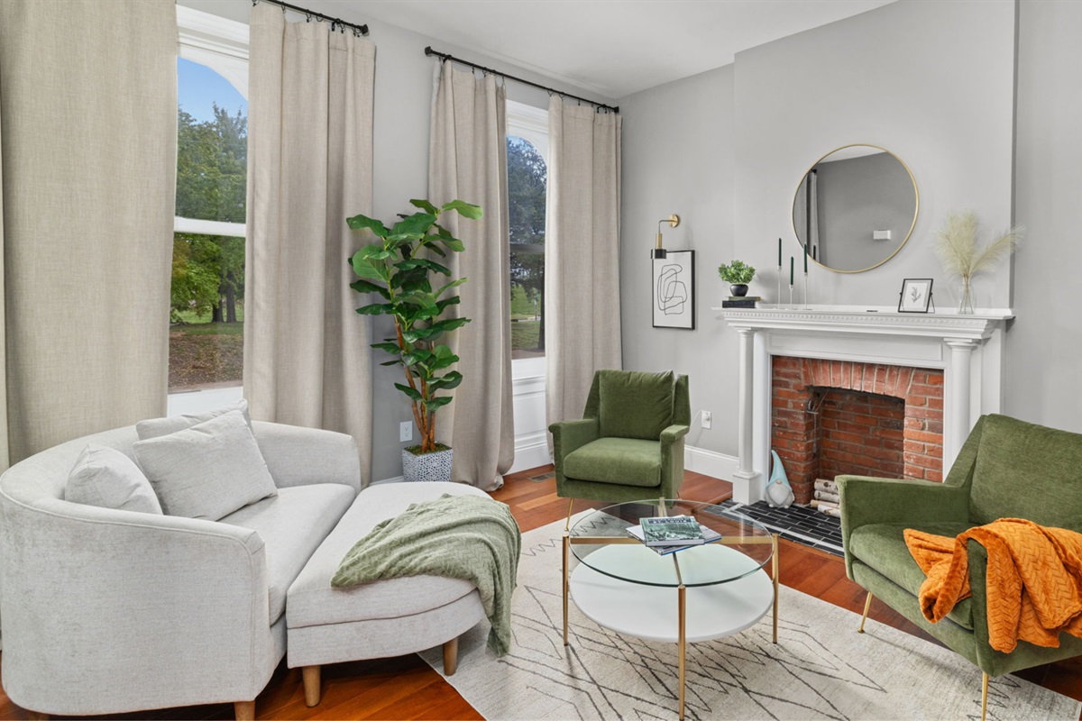 The front living room provides a comfy spot for a nice chat or reading a book.  The fire place is decorative only.