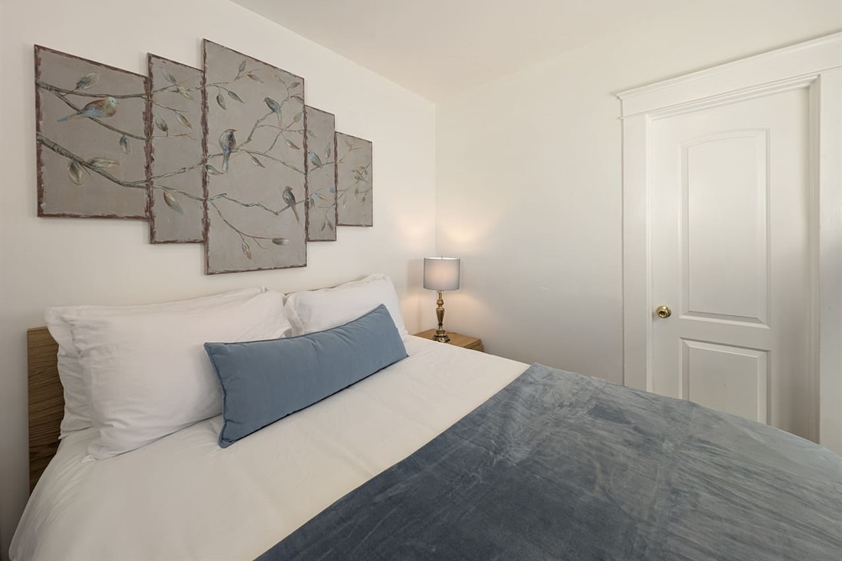 Comfortable Queen bedroom with soft linens.