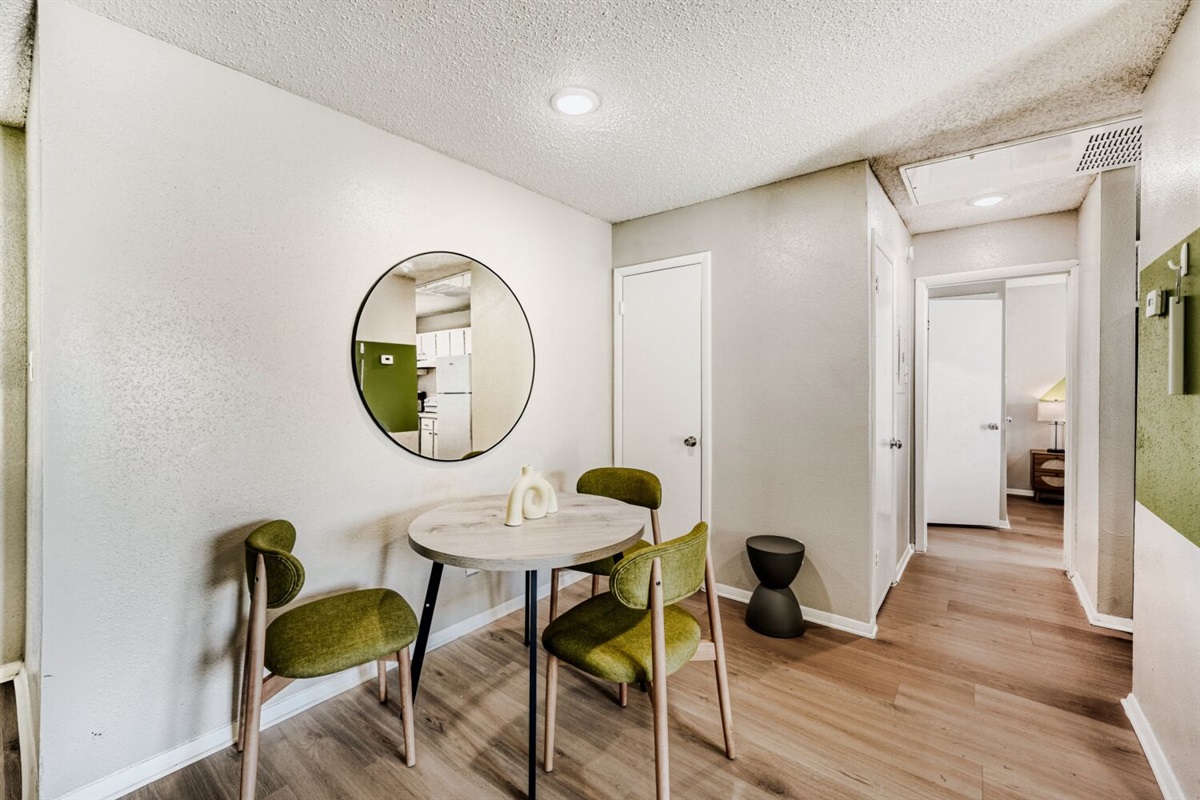 Cozy dining nook with modern décor and warm wood flooring.