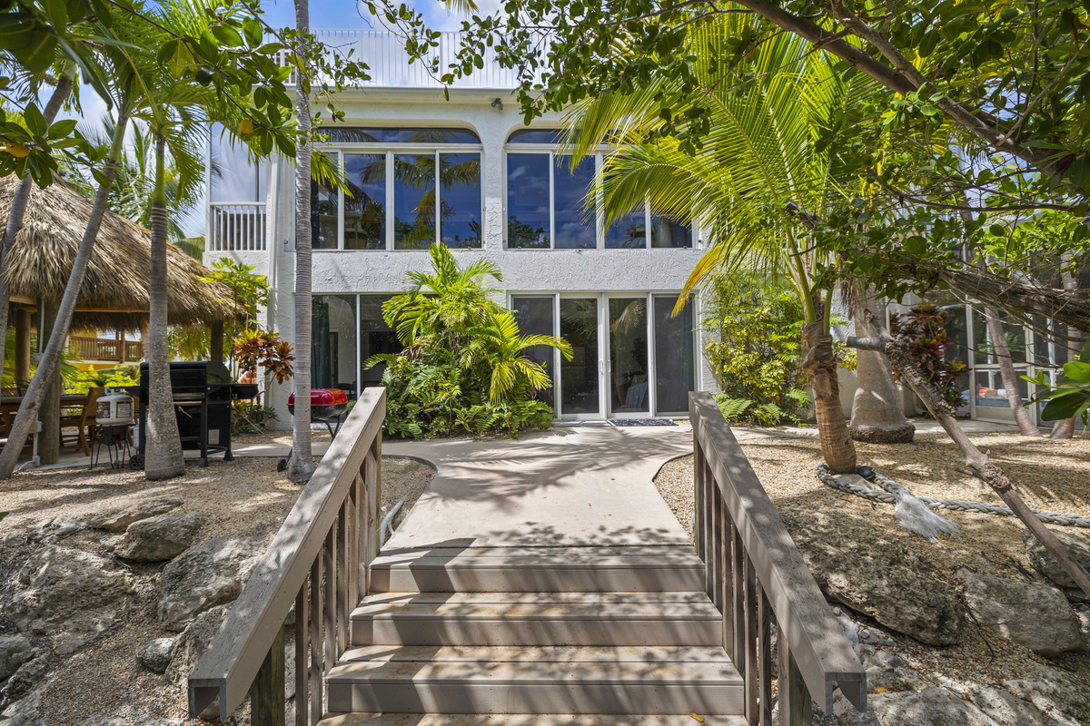 Captain's cove is surround by beautiful tropical trees.