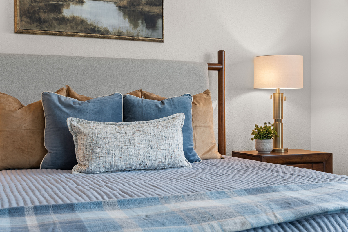 Bedside lighting on both sides makes the primary king bedroom comfortable for couples.
