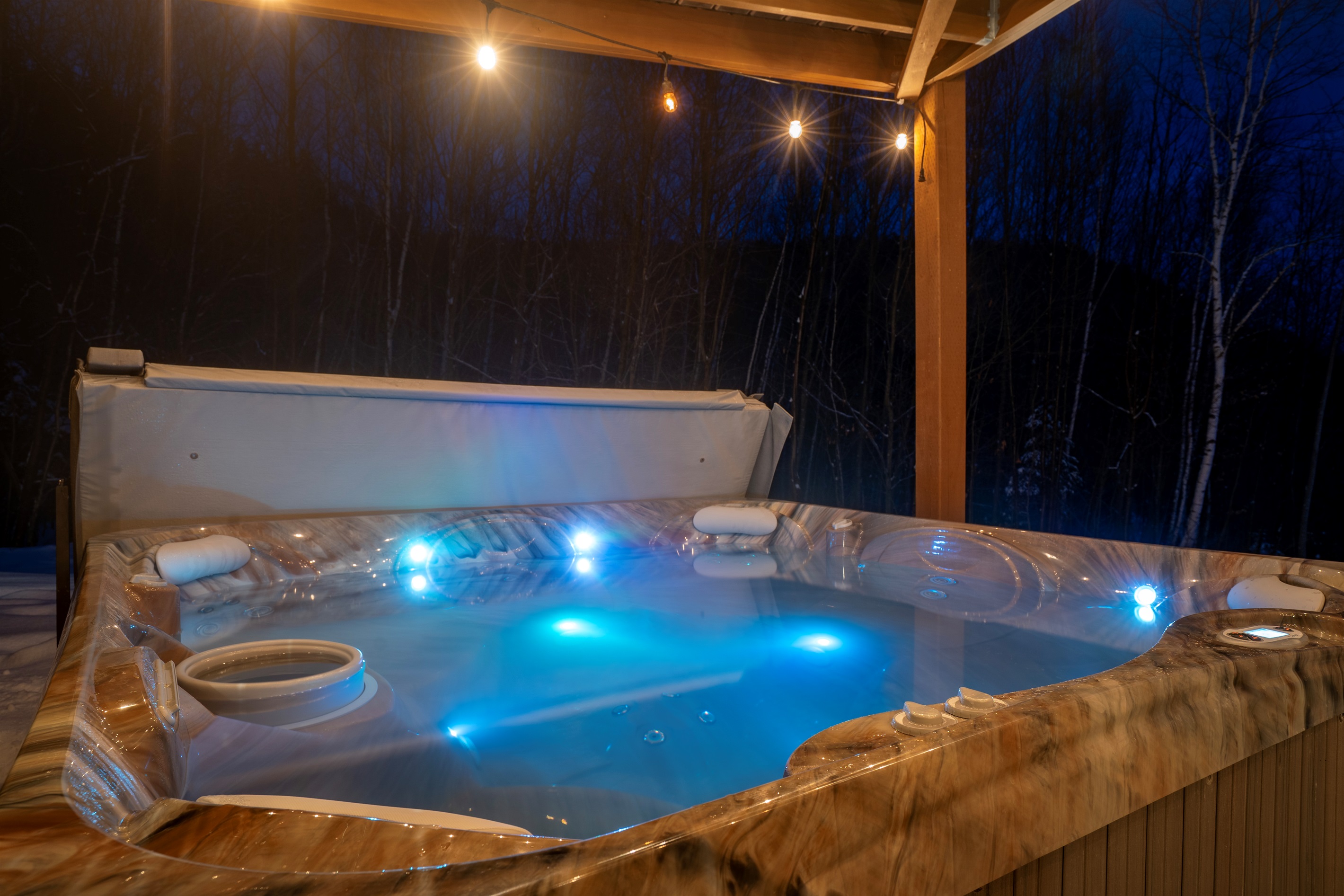 Experience ultimate relaxation with a night-time hot tub soak.