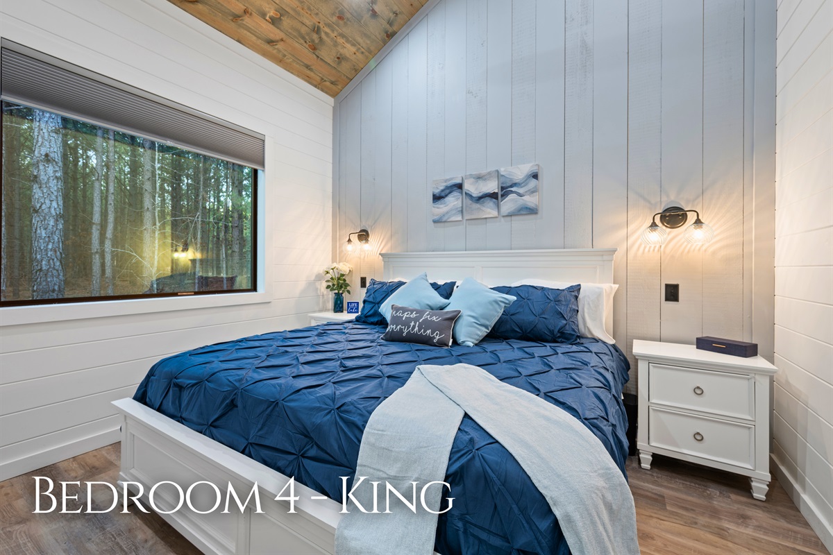 Calm colors and soft bedding give this king bedroom a peaceful atmosphere that makes it easy to unwind and recharge.