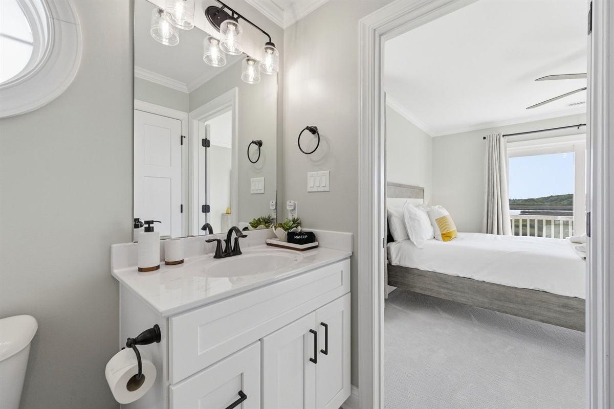 Modern ensuite bathroom with dual vanity and clean coastal-inspired finishes
