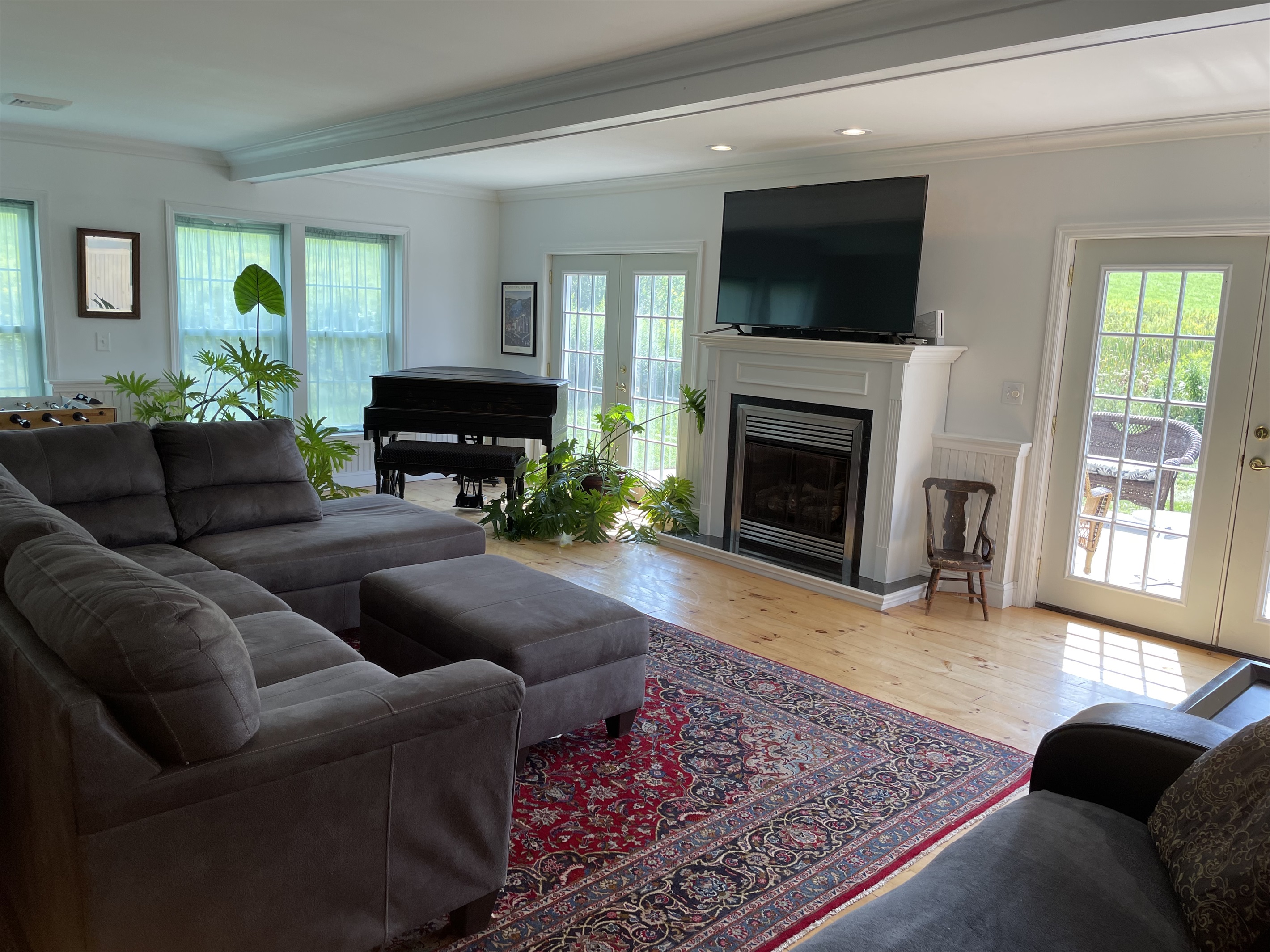 Living room with doors to side patio