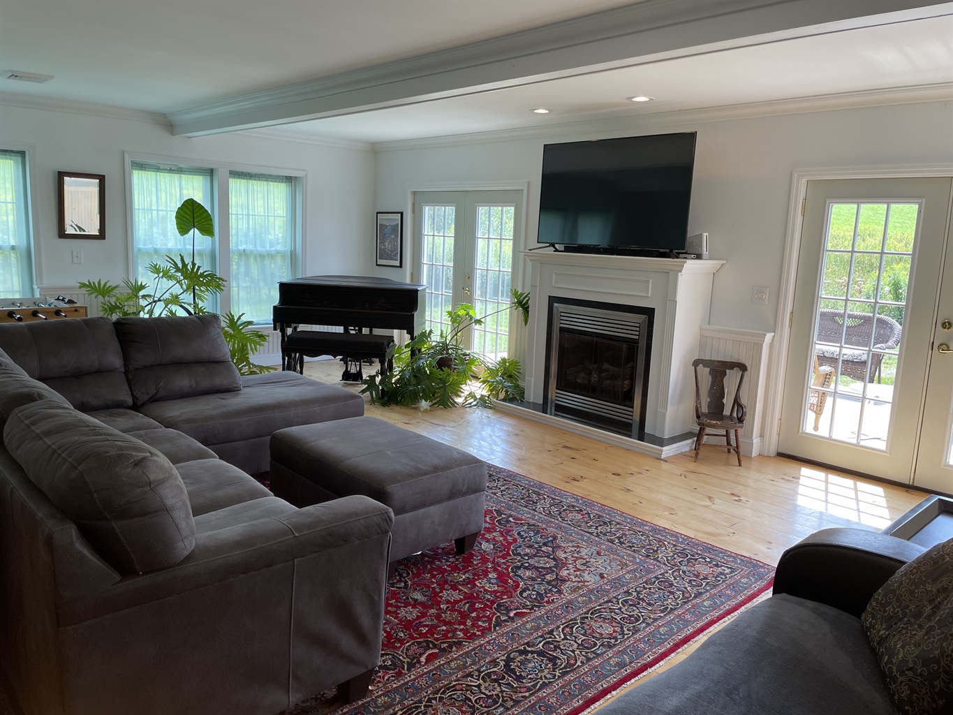 Living room with doors to side patio