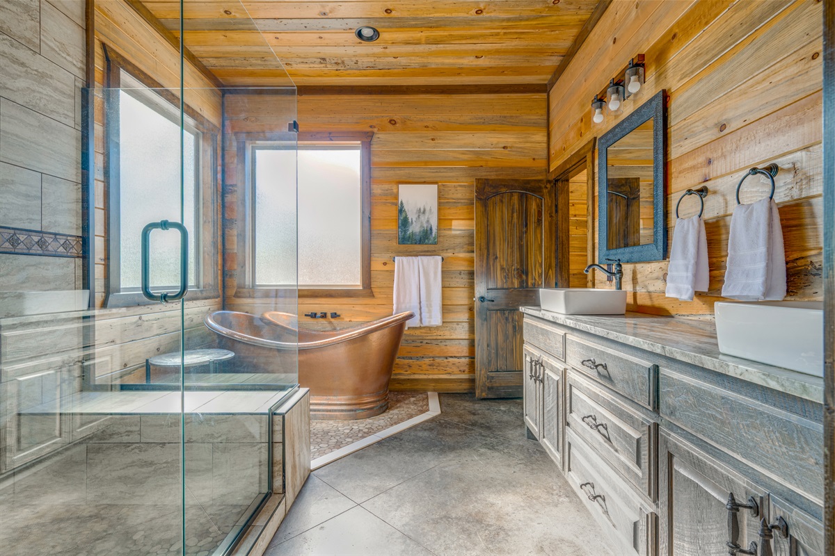 Spa-Like Retreat: Indulge in a luxurious soaking tub and rustic elegance in this stunning bath!