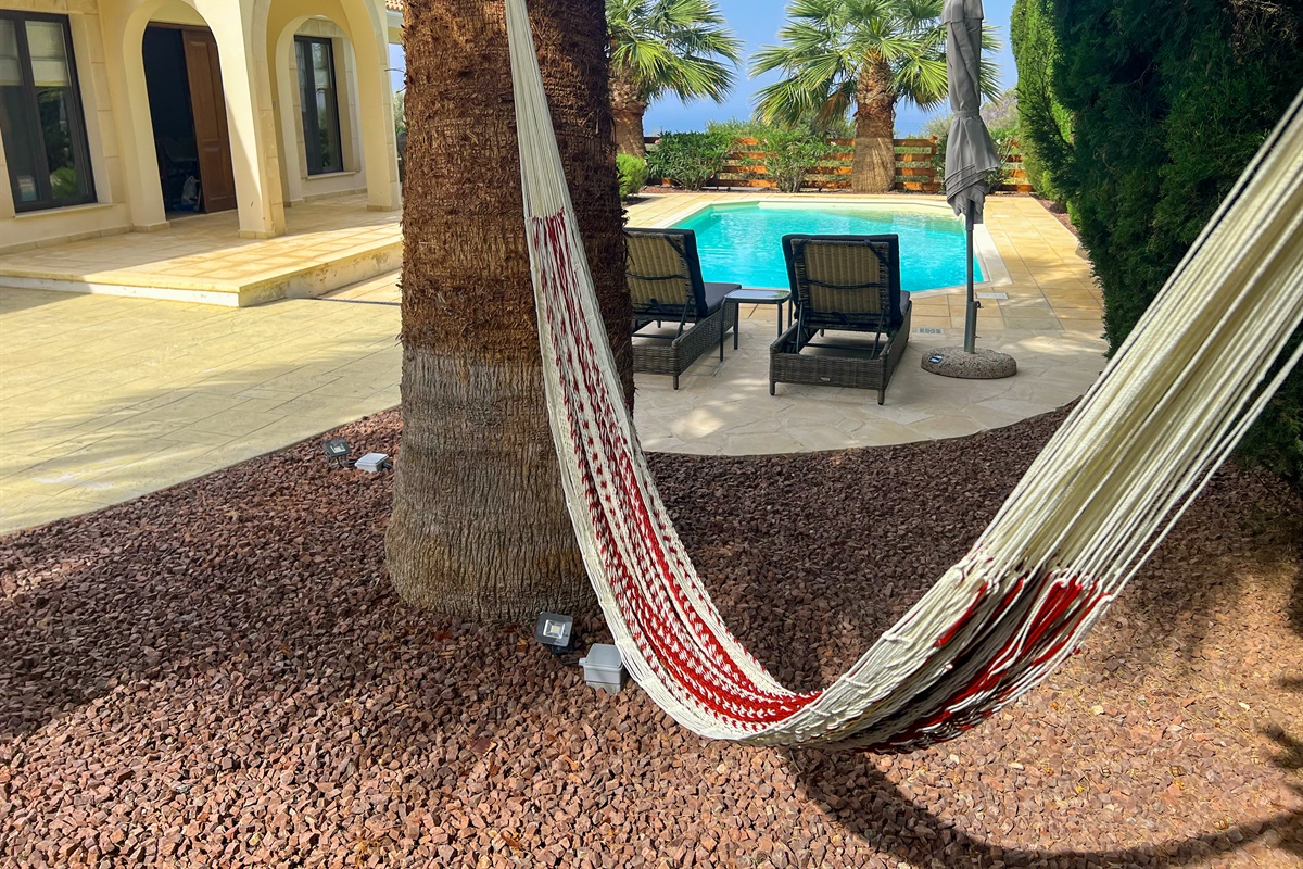 Lounge by the pool on the sun loungers or in the hammock in the shade of the palm trees. Whether you're seeking sun or shade, the different outdoor spaces provides plenty of options throughout the day.