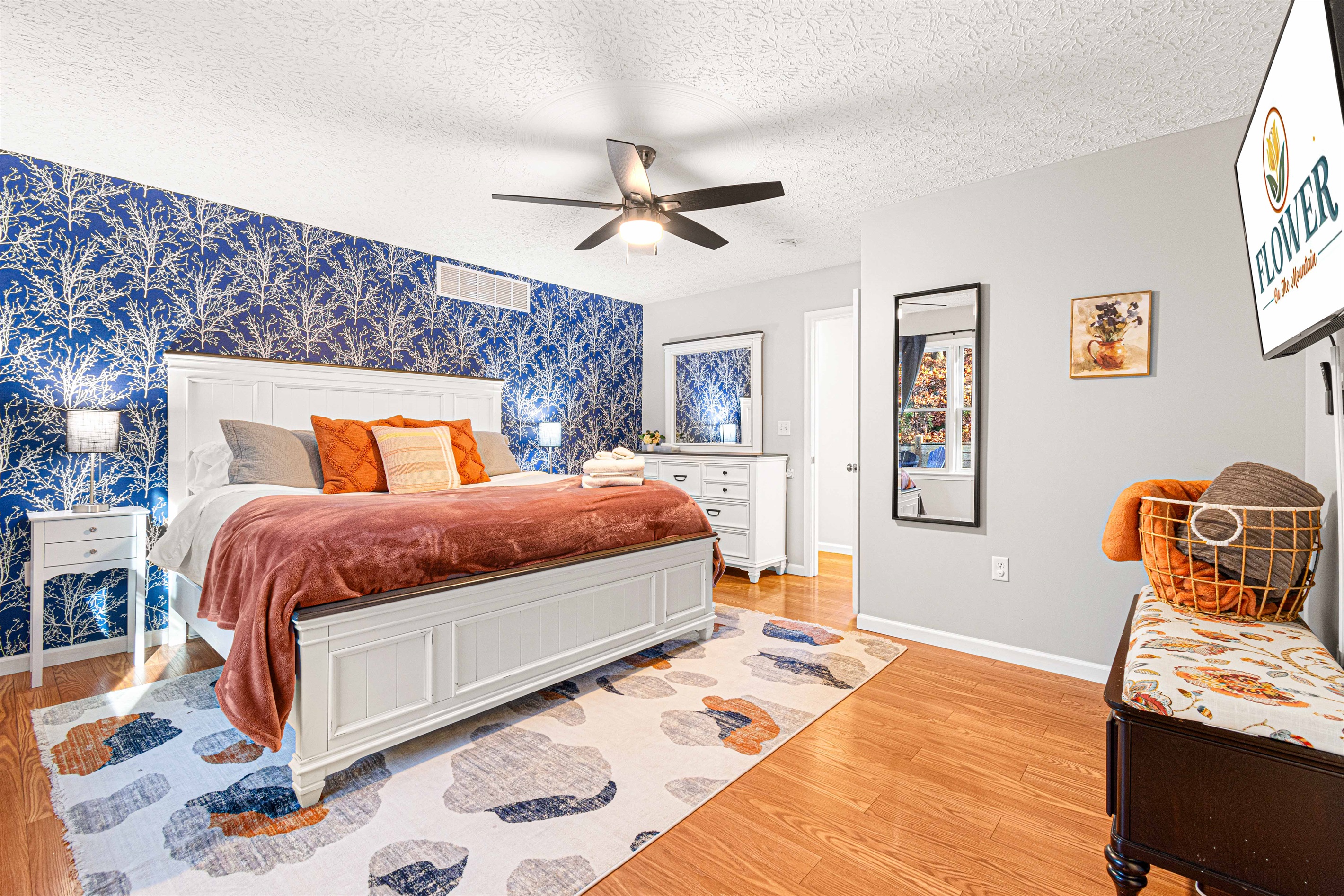 The main floor master bedroom is a luxurious retreat that boasts a king-size bed with a luxury pillowtop mattress and high-quality linens. Sink into the plush bedding and enjoy a peaceful nigh