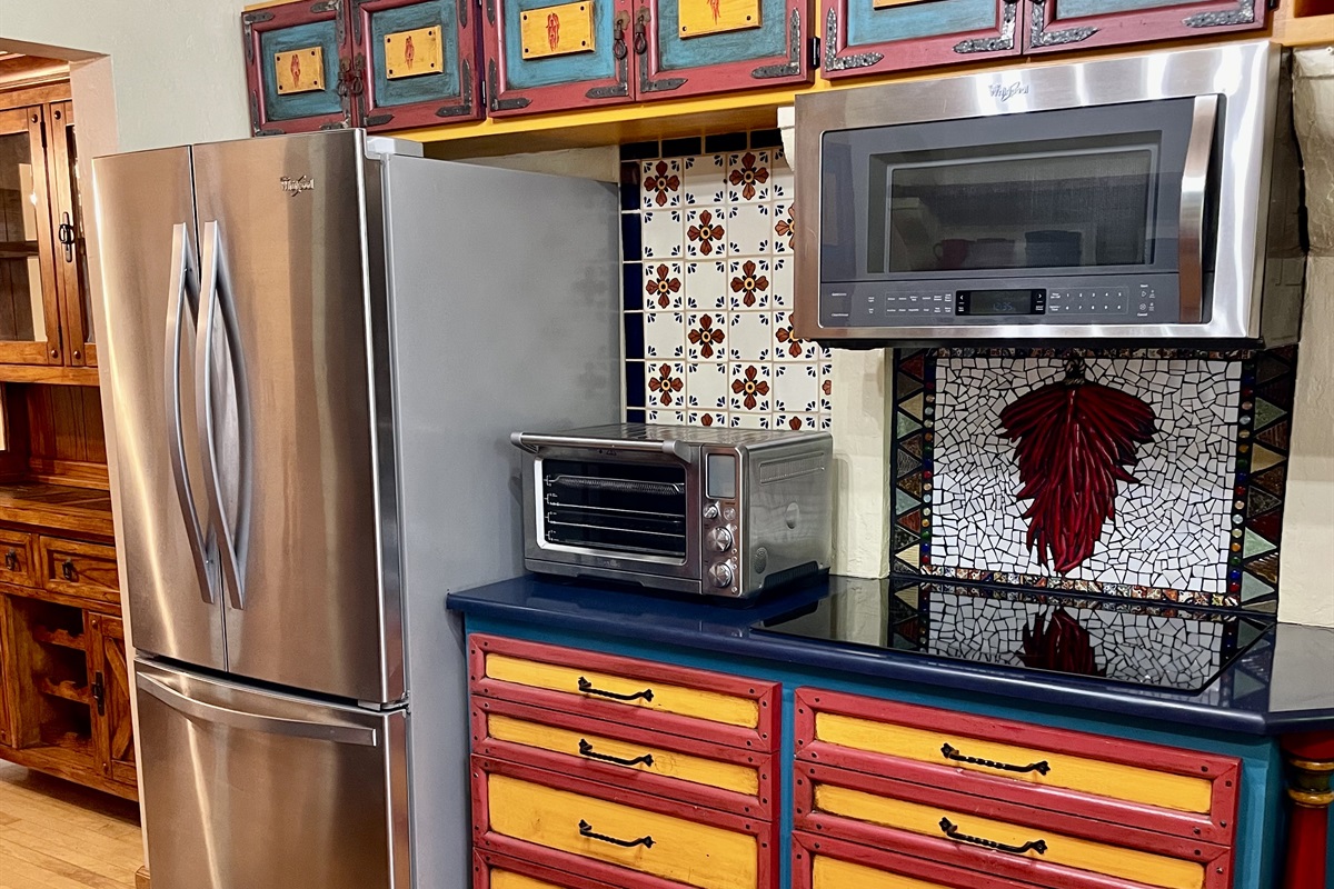 Cooking is a breeze in this fully equipped kitchen, featuring modern appliances and ample counter space.