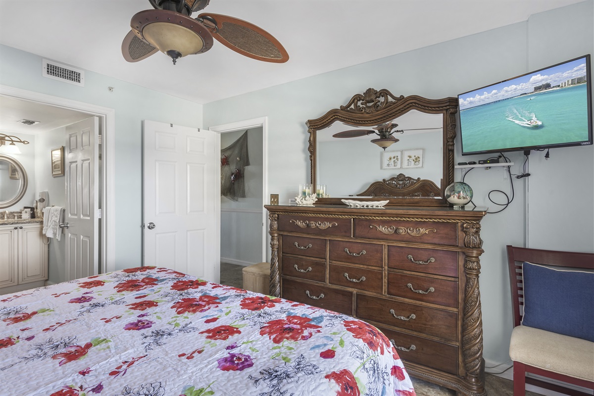 Master bedroom with smart TV and master bathroom