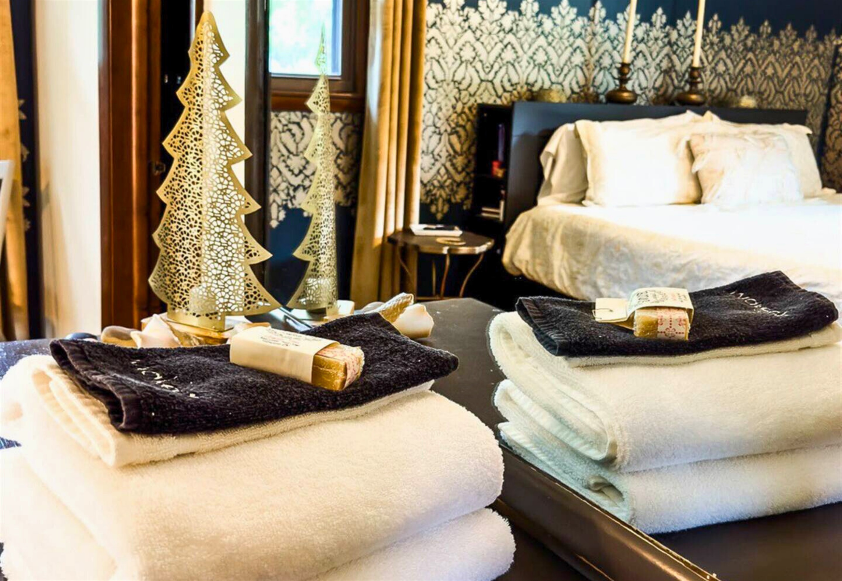 Provided Towels and Toiletries Laid Out in the Bedroom