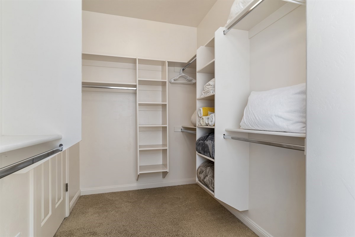Spacious walk-in closet with ample storage to keep everything organized and accessible.