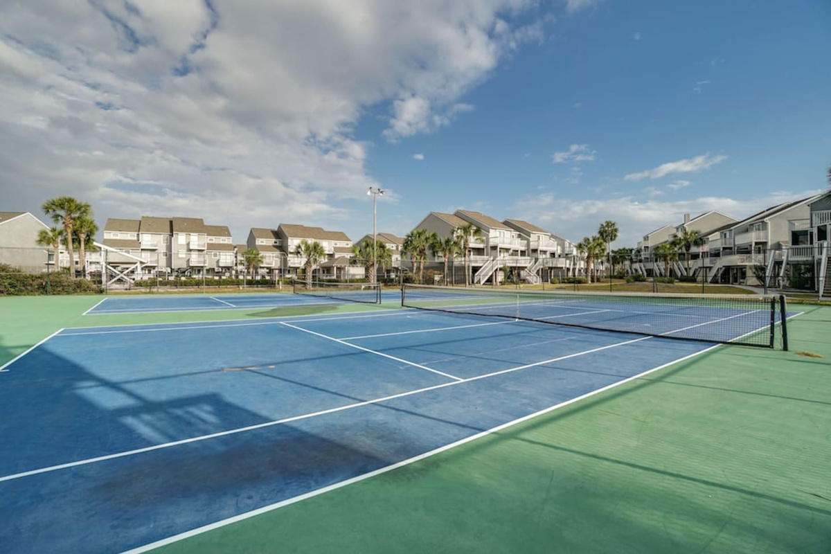 Grab a racket and head to the community courts &mdash; pickleball, tennis, or both before breakfast.