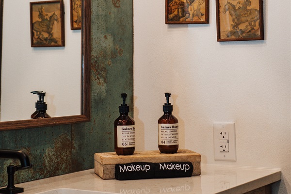 Thoughtful in-suite touches at the Corral Suite &mdash; curated bath amenities and a dedicated makeup cloth so your towels stay pristine.