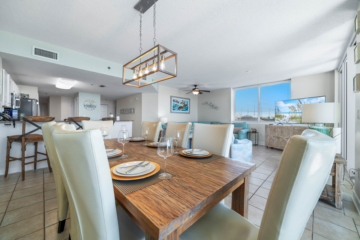 From casual meals to formal gatherings, this versatile space offers a comfortable dining area and a relaxed living space with direct balcony access.