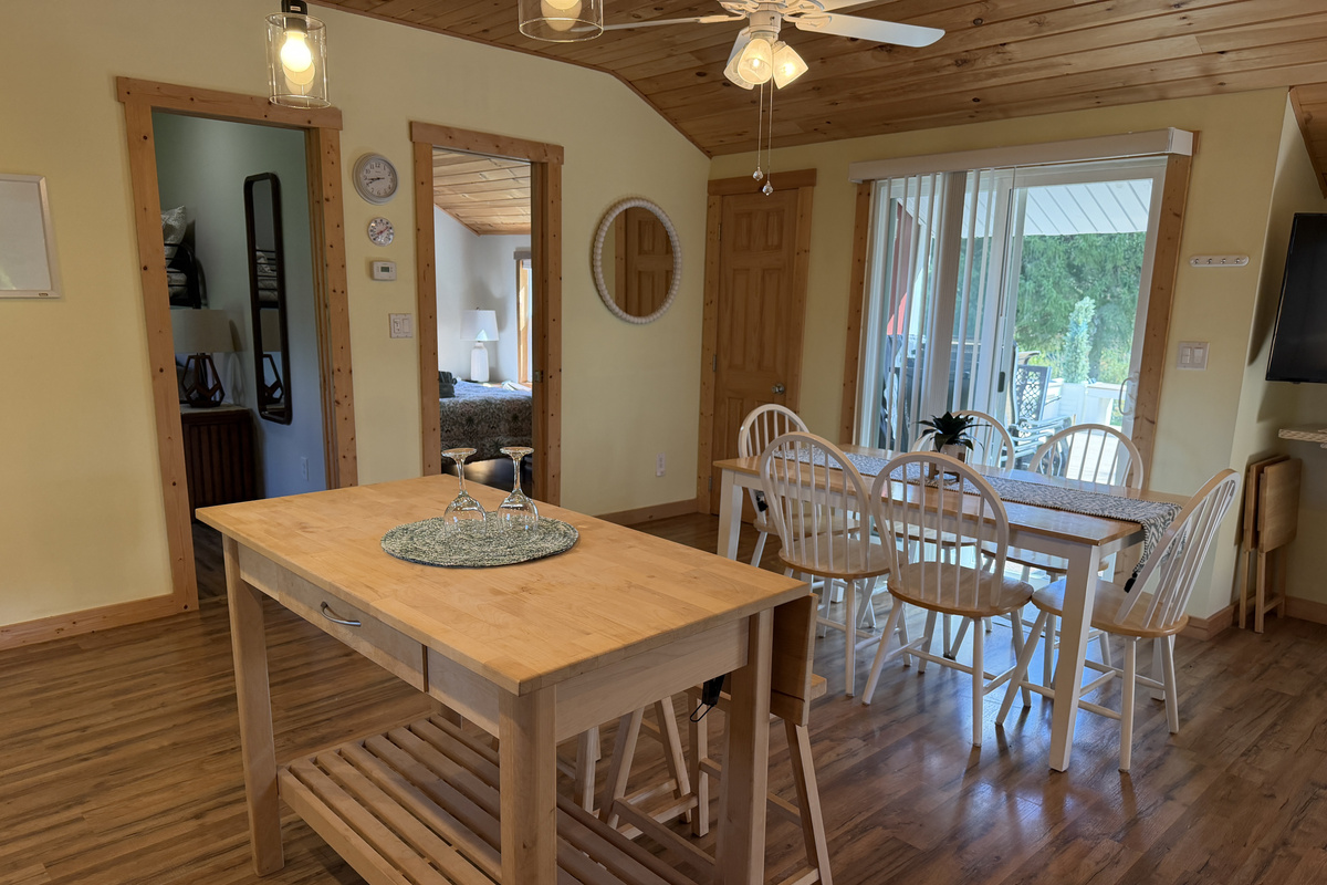 Kitchen, dining areas and sliders to back deck