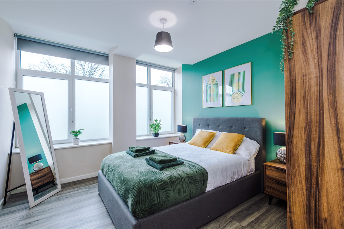 Bedroom 1 benefits from a hotel comfort large double bed, wardrobe with hangers & blackout blinds 