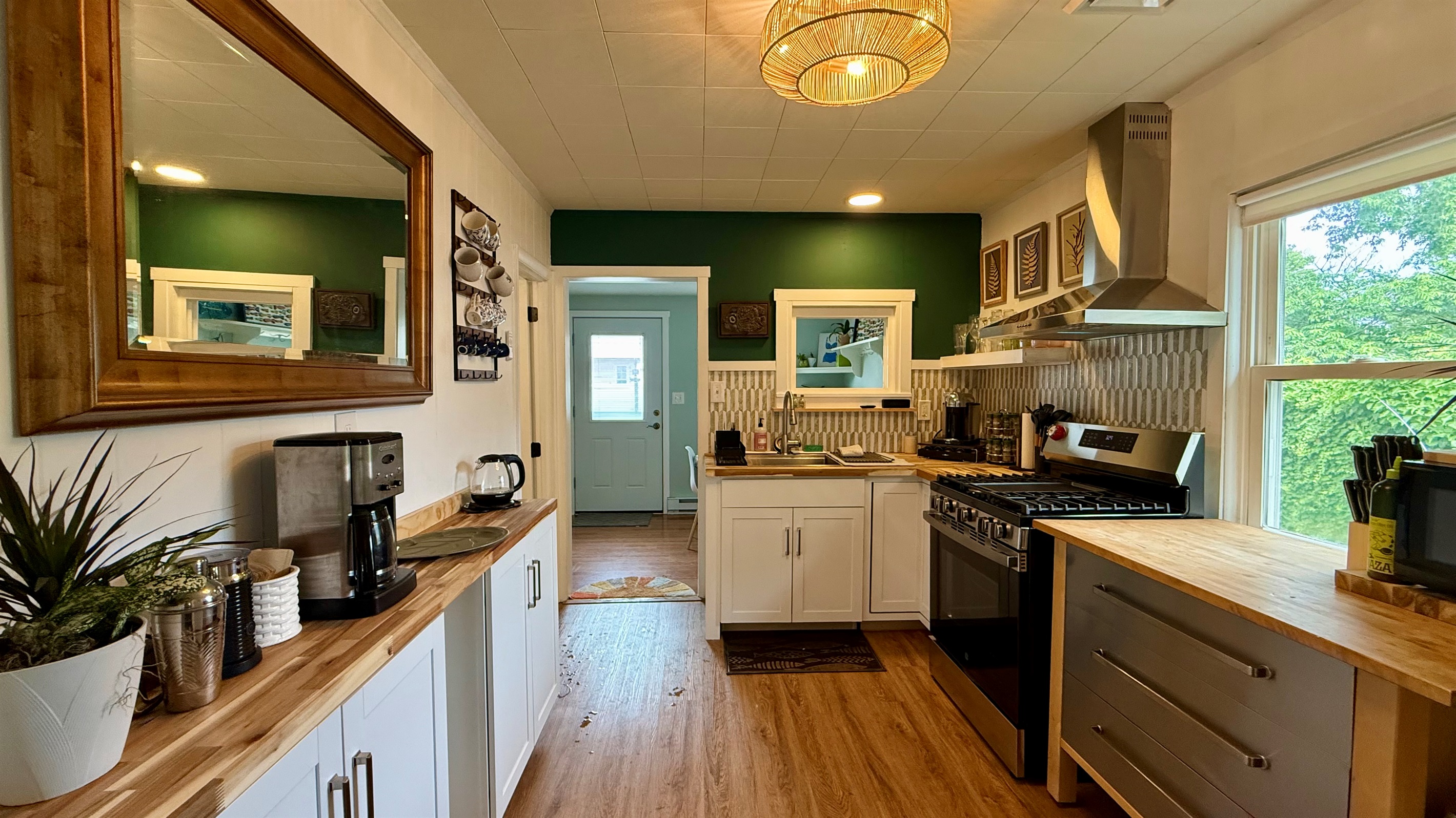 full coffee bar with espresso machine, drip coffee, and electric kettle 
