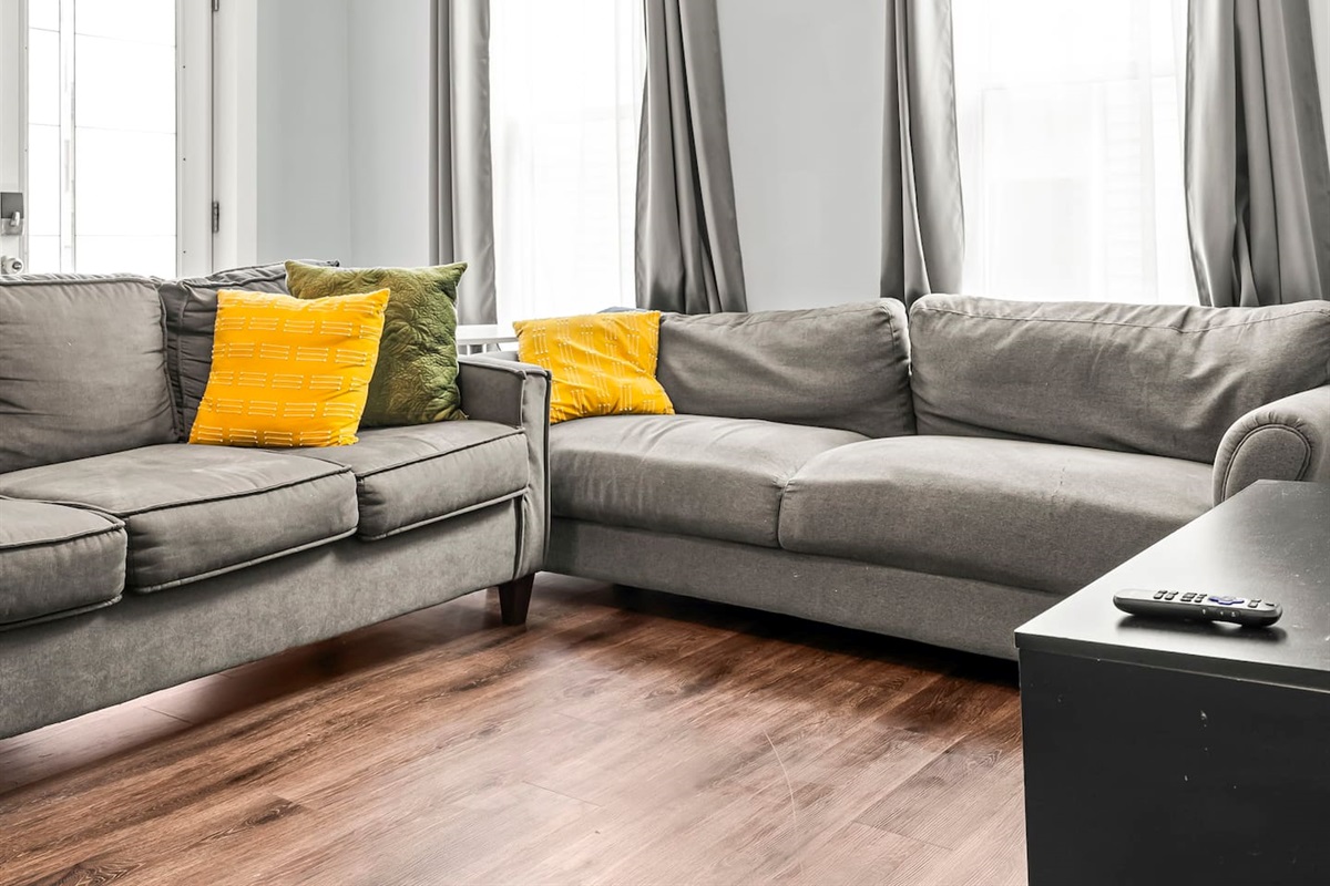 Spacious seating arrangement perfect for movie nights, conversations, or unwinding after a day exploring the city.