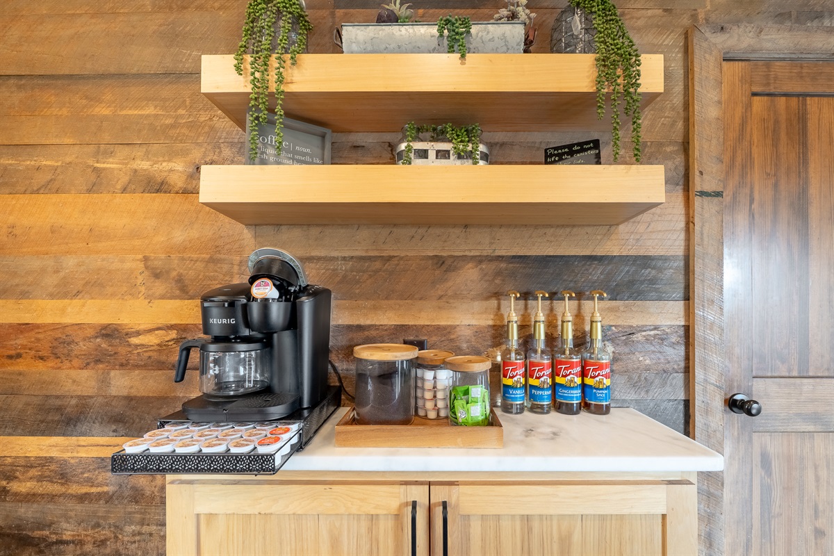Full coffee bar with Keurig Duo, K-Cups, coffee grounds, flavoring syrups, creamers, sugar packets, stevia packets, an electric kettle, and a French press!