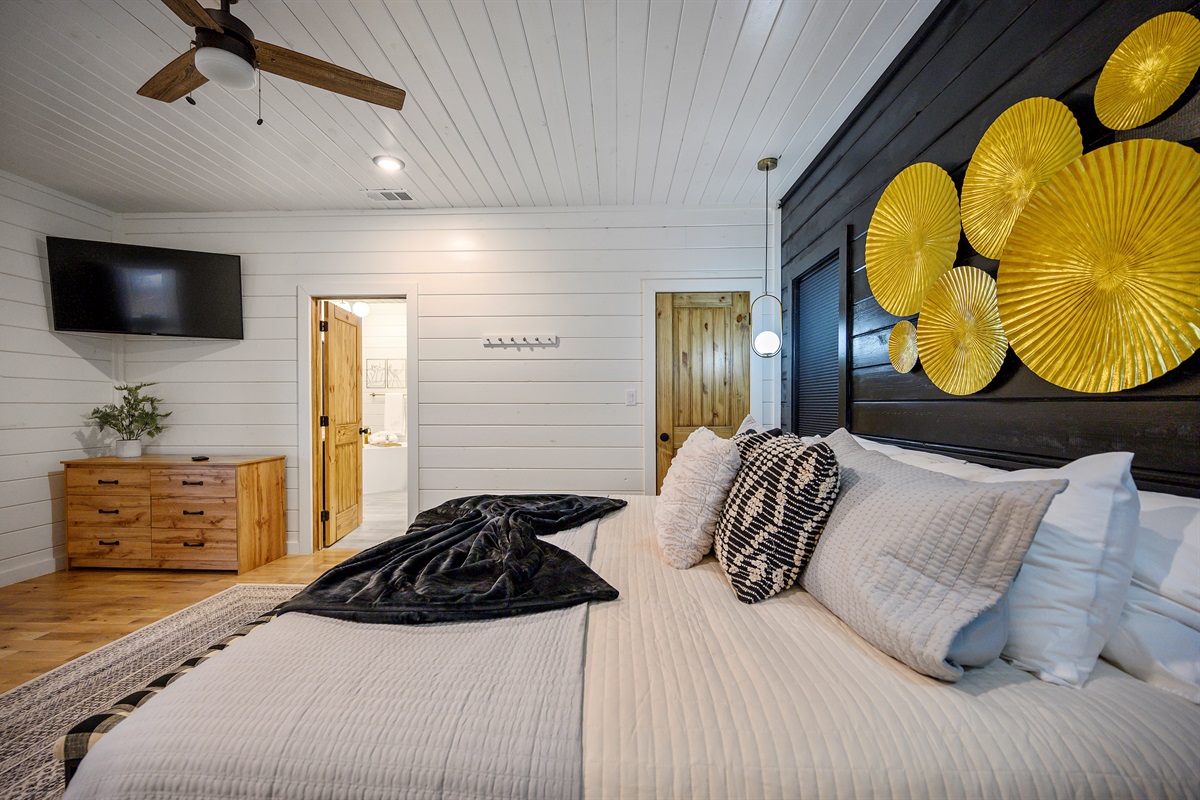 A spacious king bedroom designed for restful nights, offering a comfortable bed and a calm, private atmosphere.