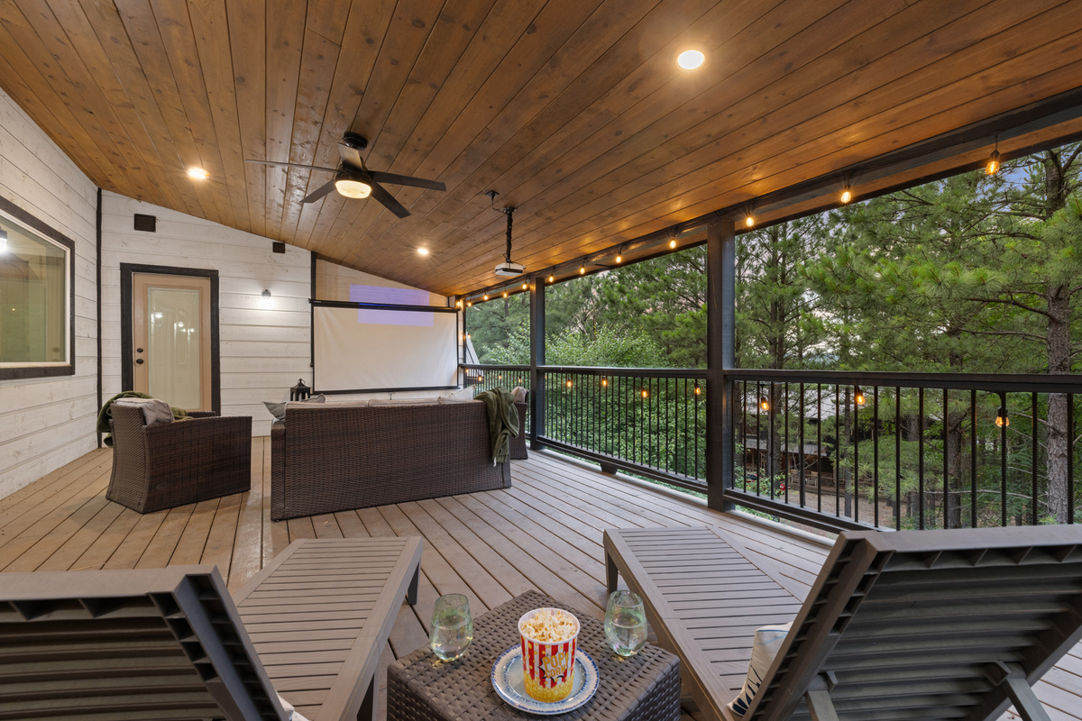 Upstairs covered deck access straight from the game room.
Morning coffee, late night laughs, and fresh air drifting through the trees. This is the kind of hangout spot that quietly becomes everyone’s favorite.