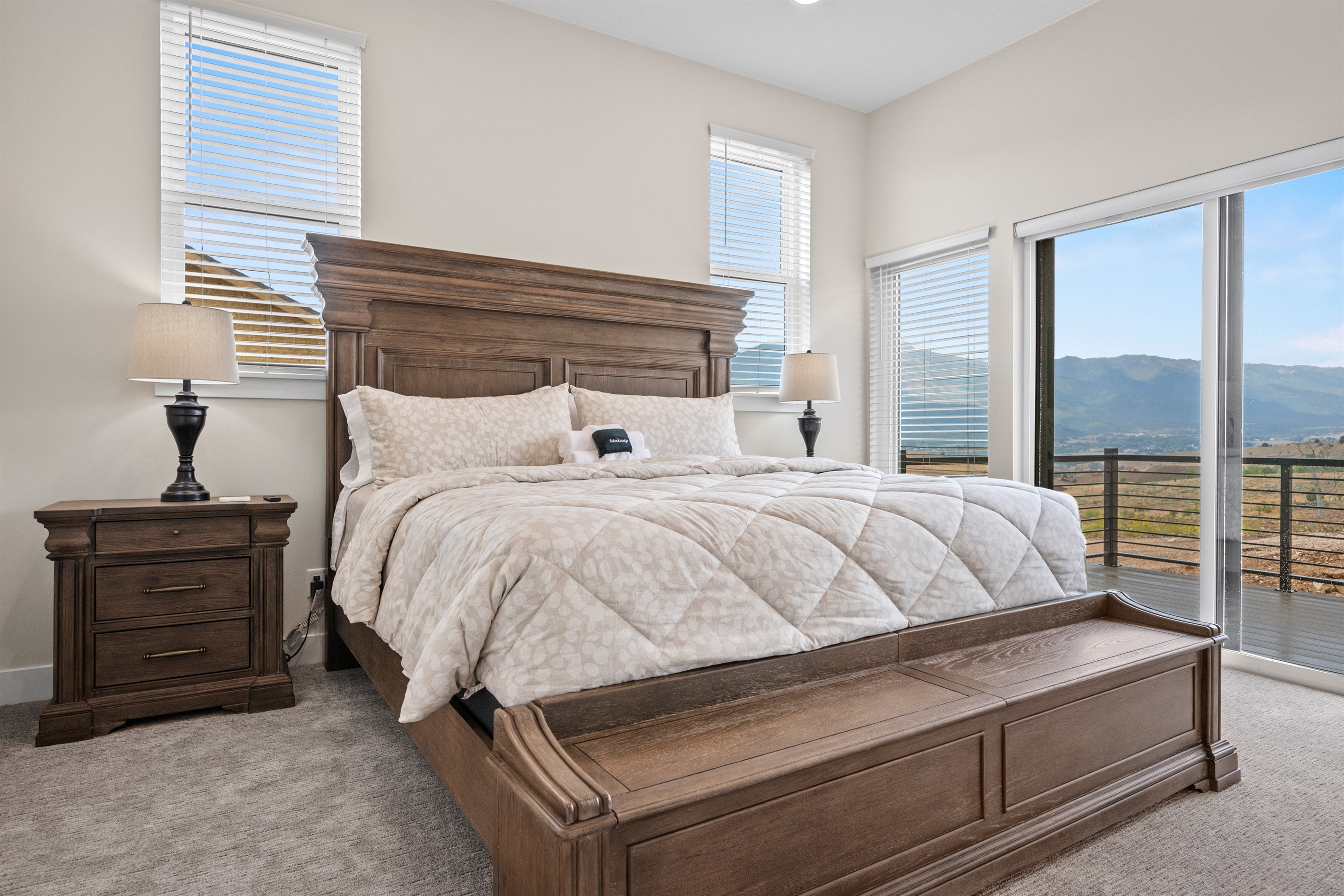 The main floor primary bedroom has a king bed with amazing views.