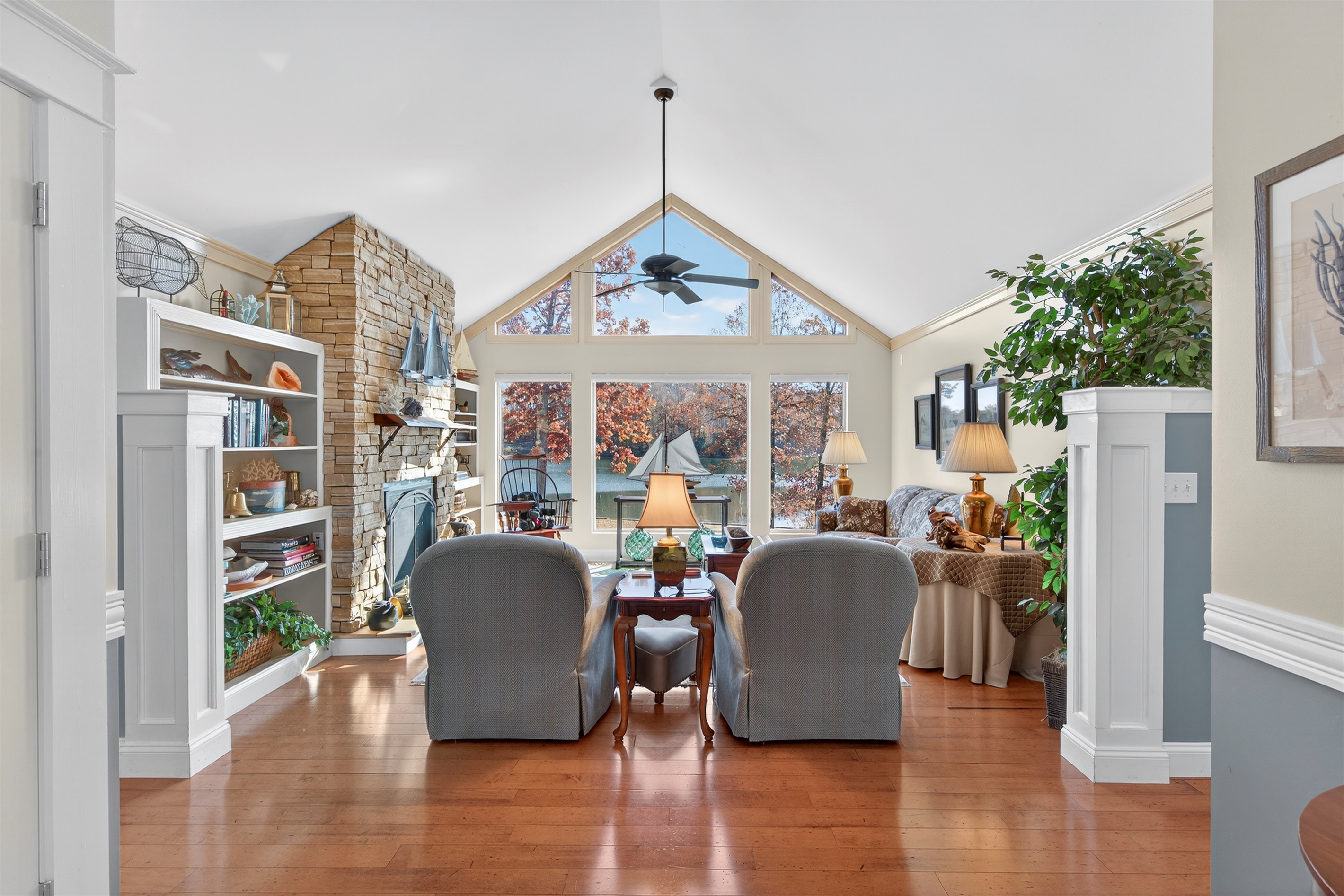 Cozy ambiance with custom shelving and lake-inspired décor throughout.