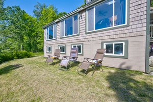 side of the property with folding chairs