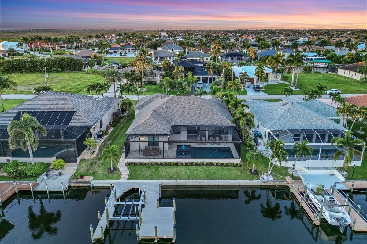 Stunning aerial view showcasing the villa's private dock and serene waterfront!
