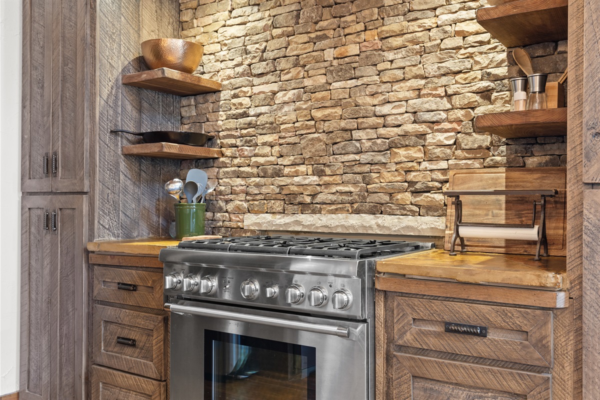 Fully equipped with high-end appliances and ample counter space, the kitchen is designed for both cooking and entertaining.