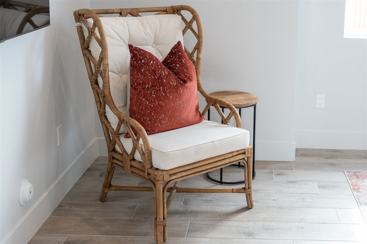 Experience comfort in the living room with a long couch, two swivel chairs, and a coffee table, creating the perfect atmosphere for socializing and leisure.