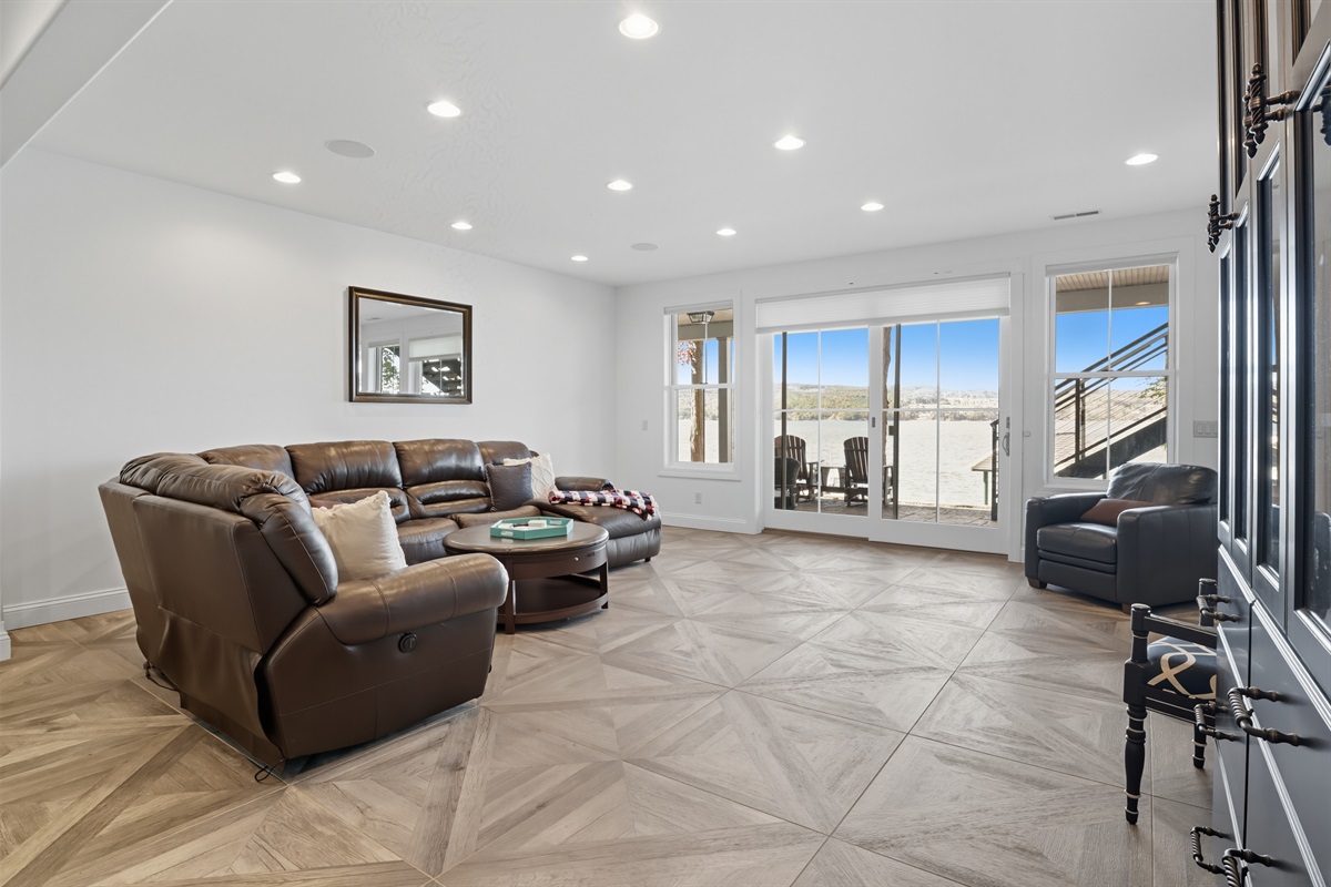 Lower level living room flowing into outdoor space.