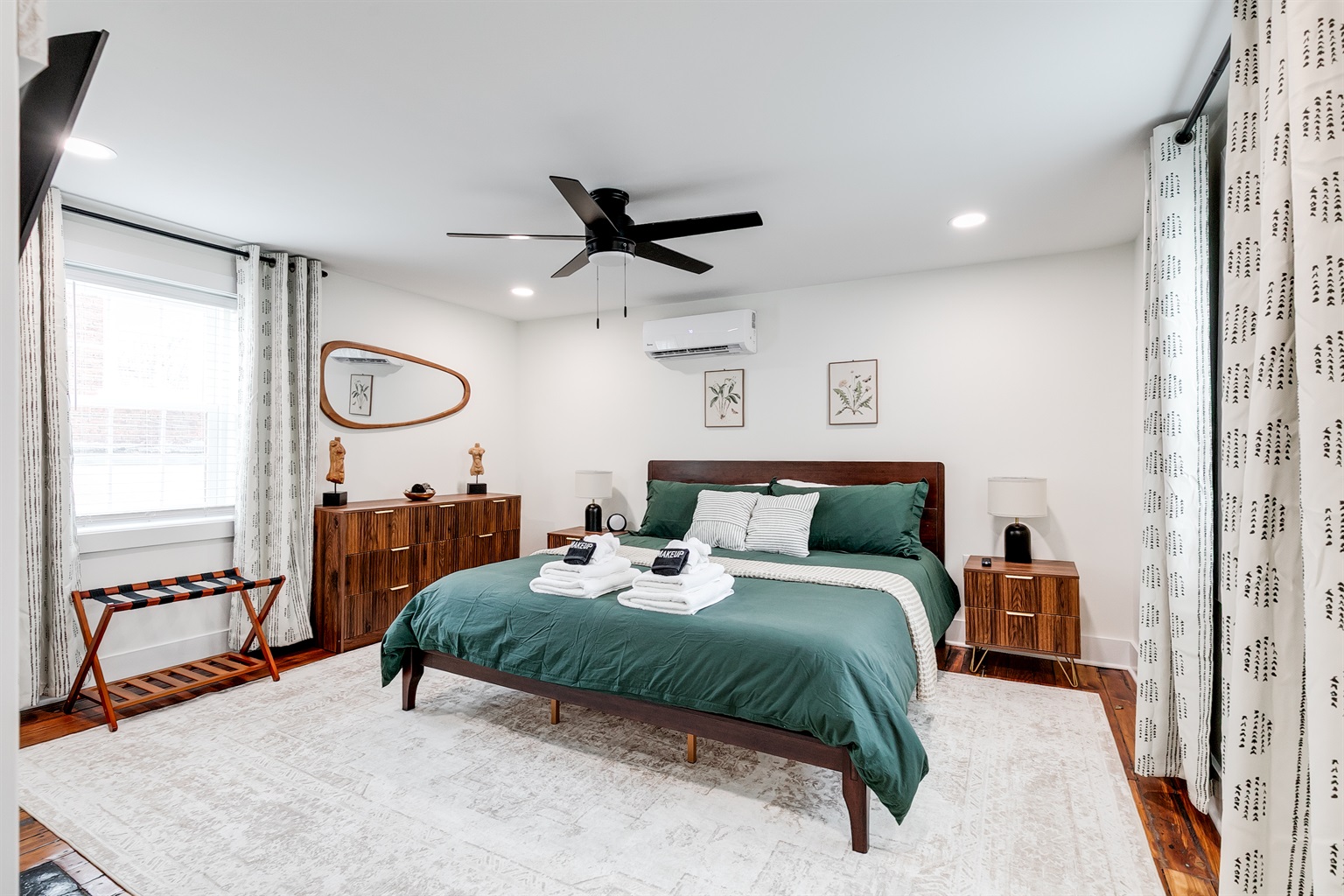 King Bedroom: Tranquil vibes with stylish decor and a plush king bed await your stay!